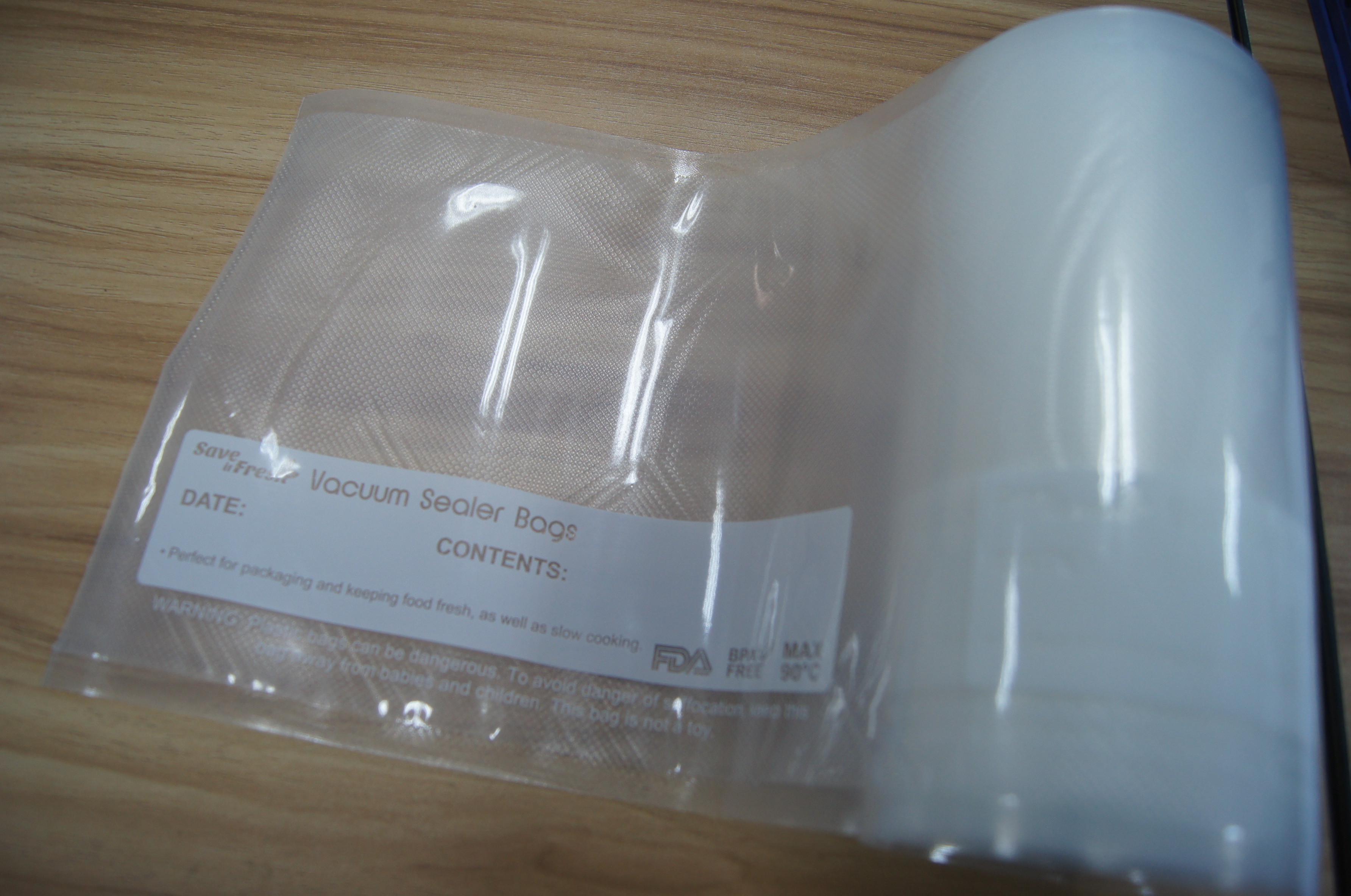 Plastic Food Packaging Rolling Vacuum Bag With Embossed Side And Printing Side