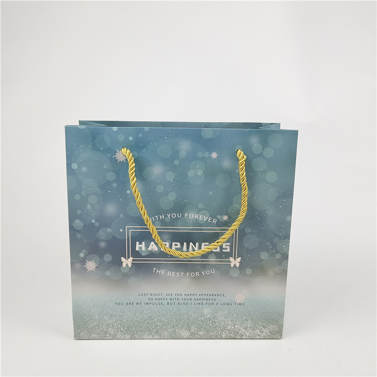 Best Selling Recyclable Environmental Friendly Logo Printed Shopping Paper Bag Packaging White 110 Gram Reusable